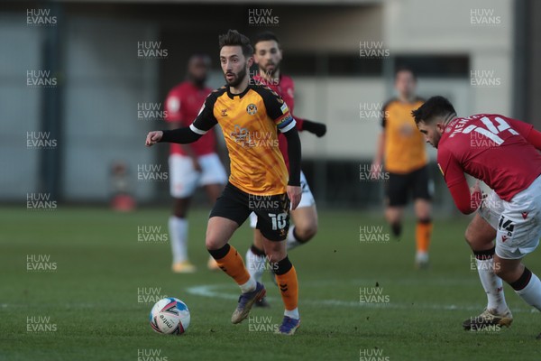 051220 - Newport County v Morecambe - Sky Bet League 2 - Josh Sheehan of Newport County launches an attack under pressure from Alex Kenyon of Morecambe