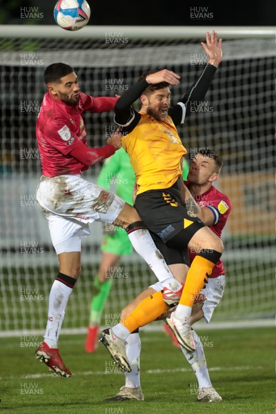 051220 - Newport County v Morecambe - Sky Bet League 2 - Jamie Proctor of Newport County is pushed in a challenge for the ball