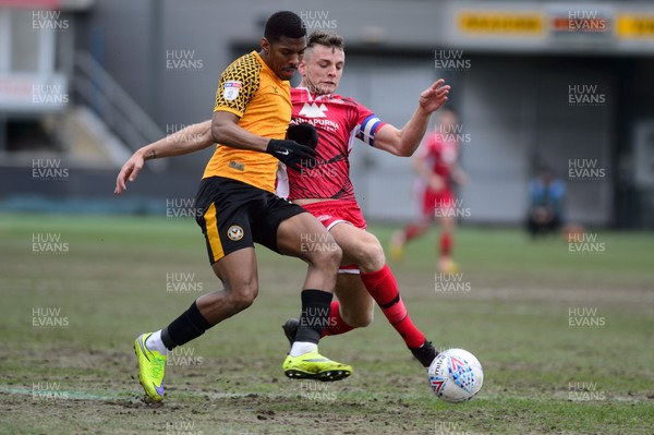 070320 - Newport County v Morecambe - Sky Bet League 2 - Tristan Abrahams of Newport County is tackled by Sam Lavelle of Morecambe 