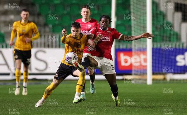 120324 - Newport County v Morecambe, EFL Sky Bet League 2 - Lewis Payne of Newport County and Nelson Khumbeni of Morecambe compete for the ball
