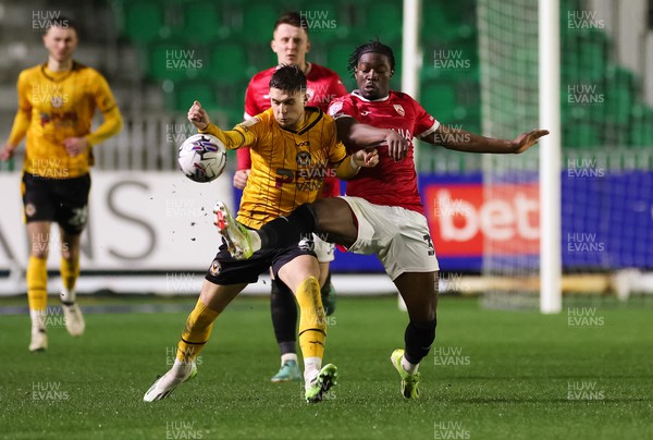 120324 - Newport County v Morecambe, EFL Sky Bet League 2 - Lewis Payne of Newport County and Nelson Khumbeni of Morecambe compete for the ball