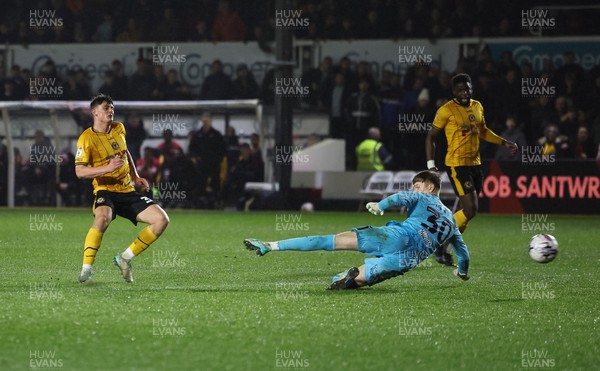 120324 - Newport County v Morecambe, EFL Sky Bet League 2 - Seb Palmer-Houlden of Newport County beats Archie Mair of Morecambe to score the fifth goal