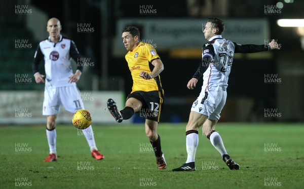 230118 - Newport County v Morecambe, SkyBet League 2 - Ben Tozer of Newport County wins the ball from Michael Rose of Morecambe