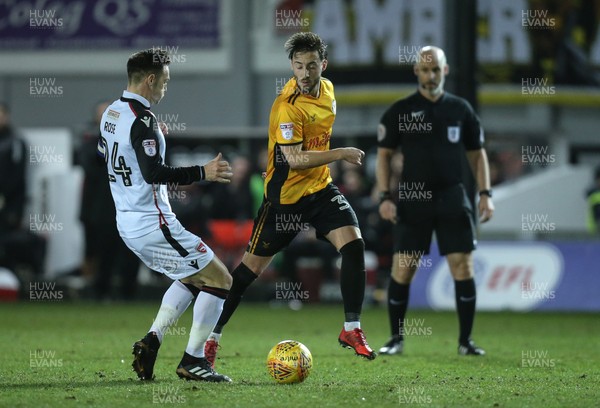 230118 - Newport County v Morecambe, SkyBet League 2 - Josh Sheehan of Newport County takes on Michael Rose of Morecambe
