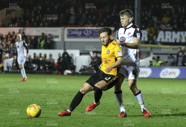 230118 - Newport County v Morecambe, SkyBet League 2 - Josh Sheehan of Newport County is challenged by Sam Lavelle of Morecambe