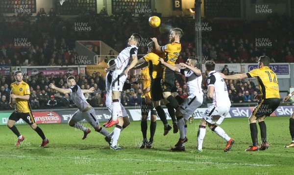 230118 - Newport County v Morecambe, SkyBet League 2 - Mark O'Brien of Newport County tries to head a shot at goal