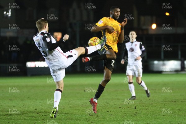 230118 - Newport County v Morecambe, SkyBet League 2 - Emmanuel Osadebe of Newport County and Steven Old of Morecambe compete for the ball