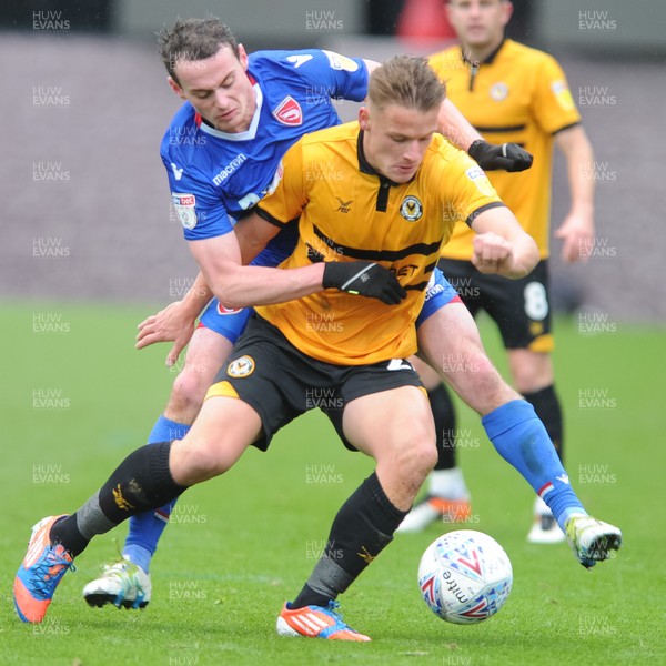 271018 - Newport County v Morecambe  Rovers - Sky Bet League 2 - Cameron Pring of Newport County holds off Liam Mandeville of Morecambe  