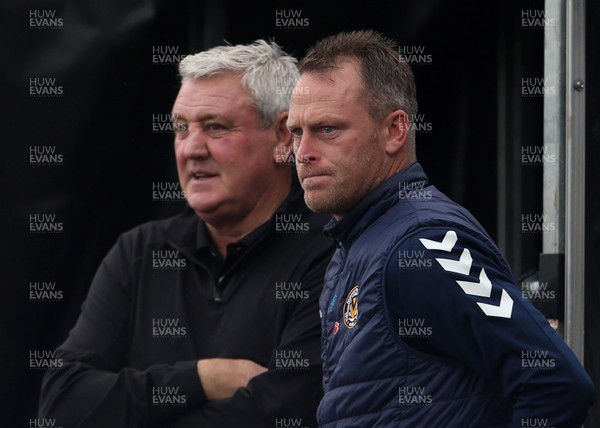 300920 - Newport County v Newcastle United - Carabao Cup - Newcastle United Manager Steve Bruce and Newport County Manager Michael Flynn before the game