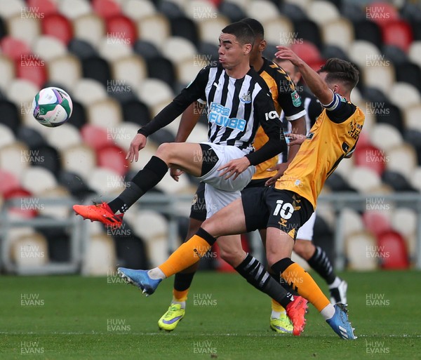 300920 - Newport County v Newcastle United - Carabao Cup - Miguel Almiron of Newcastle United is challenged by Josh Sheehan of Newport County