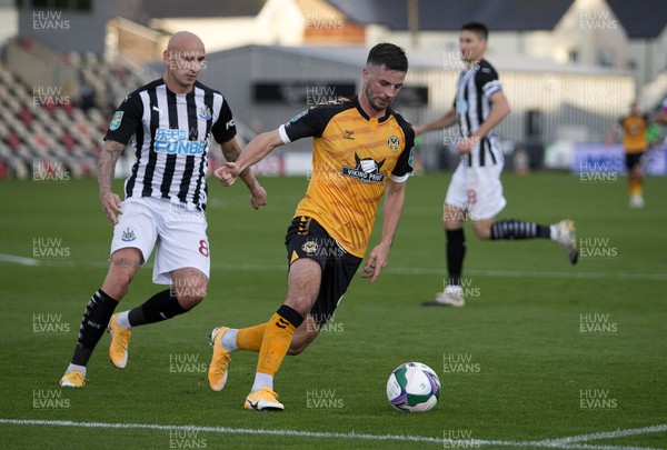 300920 - Newport County v Newcastle United - Carabao Cup - Padraig Amond of Newport County is challenged by Jonjo Shelvey of Newcastle United