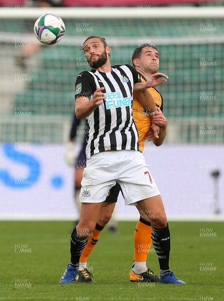 300920 - Newport County v Newcastle United - Carabao Cup - Andy Carroll of Newcastle United is challenged by Matthew Dolan of Newport County