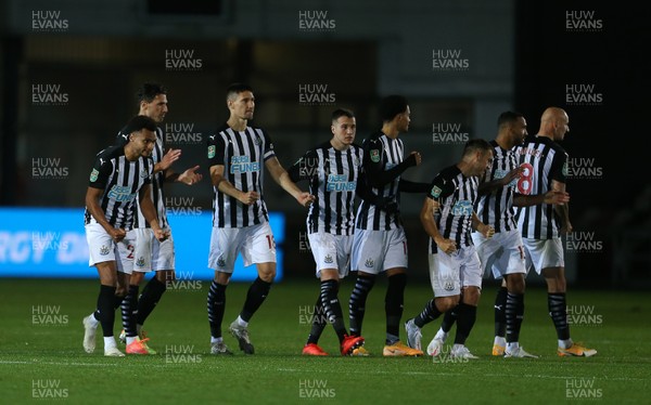 300920 - Newport County v Newcastle United - Carabao Cup - Newcastle United players celebrate after winning the game on penalties