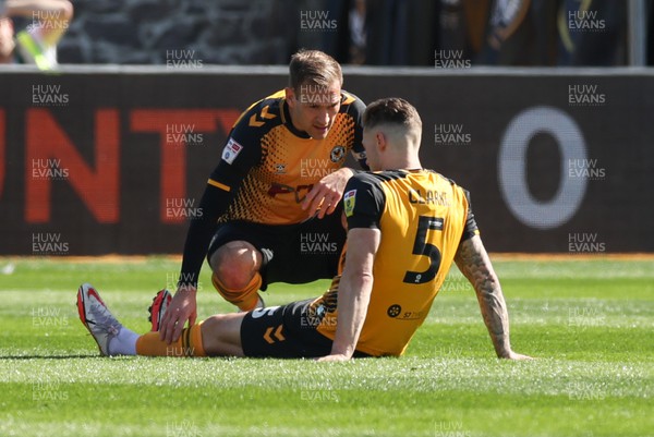 070423 - Newport County v Northampton Town, EFL Sky Bet League 2 - Mickey Demetriou of Newport County with James Clarke of Newport County after an injury