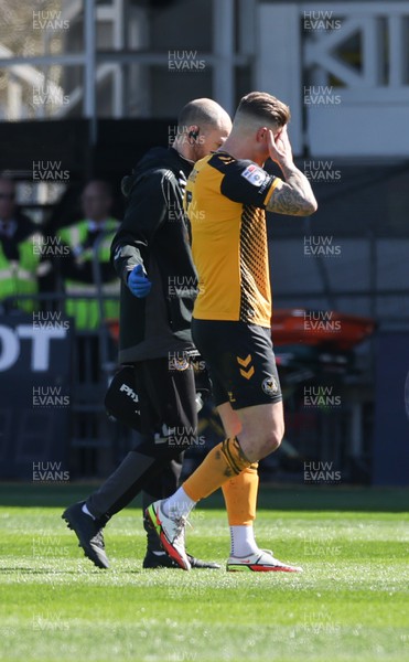 070423 - Newport County v Northampton Town, EFL Sky Bet League 2 - James Clarke of Newport County leaves the pitch after an injury
