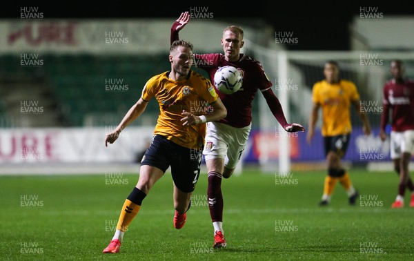 140921 - Newport County v Northampton Town, Sky Bet League 2 - Cameron Norman of Newport County lholds off Mitch Pinnock of Northampton Town