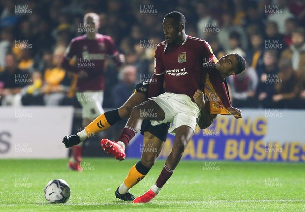 140921 - Newport County v Northampton Town, Sky Bet League 2 - Nicke Kabamba of Northampton Town and Priestley Farquharson of Newport County tangle as they compete for the ball