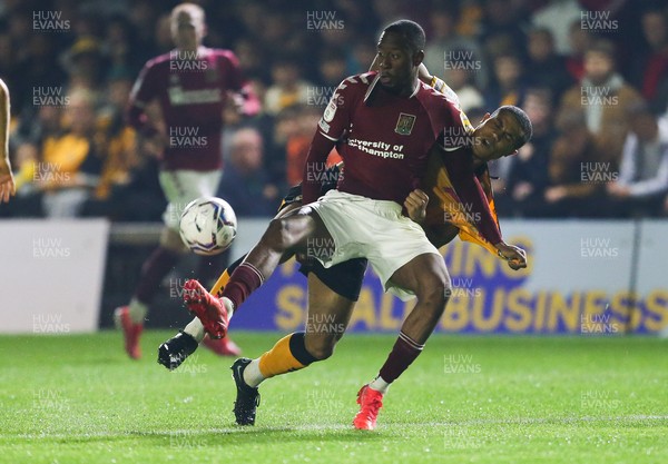 140921 - Newport County v Northampton Town, Sky Bet League 2 - Nicke Kabamba of Northampton Town and Priestley Farquharson of Newport County tangle as they compete for the ball