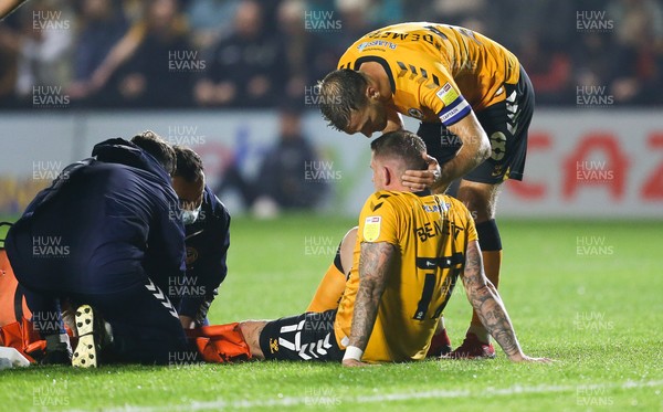 140921 - Newport County v Northampton Town, Sky Bet League 2 -Scot Bennett of Newport County is comforted by Mickey Demetriou of Newport County after he is injured