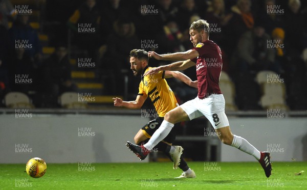 271118 - Newport County v Northampton Town - SkyBet League 2 - Josh Sheehan of Newport County is tackled by Sam Foley of Northampton Town