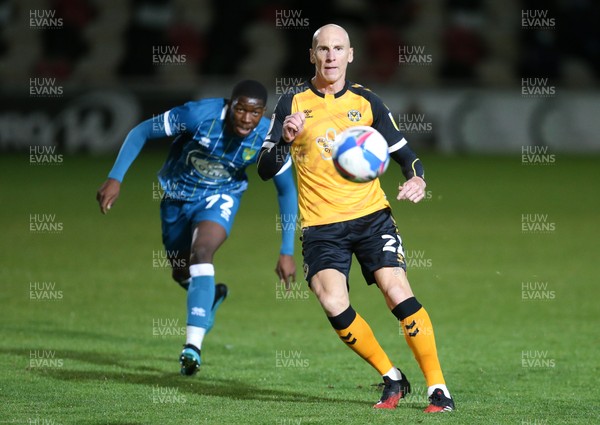 061020 - Newport County v Norwich City U21,  EFL Trophy - Kevin Ellison of Newport County plays the ball forward as Nelson Khumbeni of Norwich City Under-21s closes in