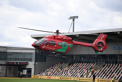 020825 - Newport County v Notts County - Sky Bet League 2 - An Emergency Helicopter lands on the pitch at Rodney Parade after a serious medical incident with a Notts County fan before the match, causing evacuation of the stadium