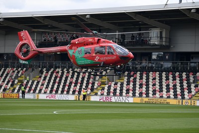 020825 - Newport County v Notts County - Sky Bet League 2 - An Emergency Helicopter lands on the pitch at Rodney Parade after a serious medical incident with a Notts County fan before the match, causing evacuation of the stadium