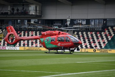 020825 - Newport County v Notts County - Sky Bet League 2 - An Emergency Helicopter lands on the pitch at Rodney Parade after a serious medical incident with a Notts County fan before the match, causing evacuation of the stadium