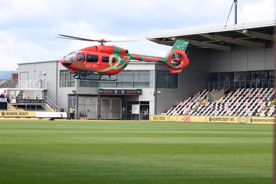 020825 - Newport County v Notts County - Sky Bet League 2 - An Emergency Helicopter lands on the pitch at Rodney Parade after a serious medical incident with a Notts County fan before the match, causing evacuation of the stadium