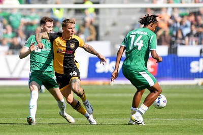 020825 - Newport County v Notts County - Sky Bet League 2 - Kai Whitmore of Newport County is challenged by Milai Perott of Notts County