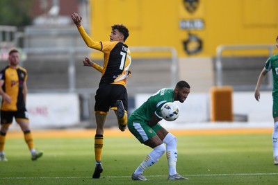 020825 - Newport County v Notts County - Sky Bet League 2 - Joe Thomas of Newport County wins the header