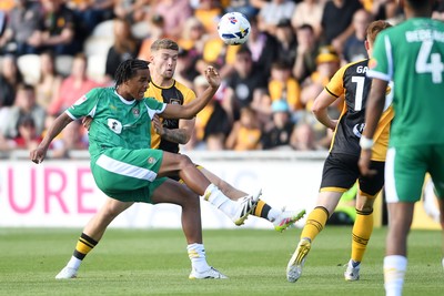 020825 - Newport County v Notts County - Sky Bet League 2 - Cameron Evans of Newport County is challenged by Tom Iorpenda of Notts County