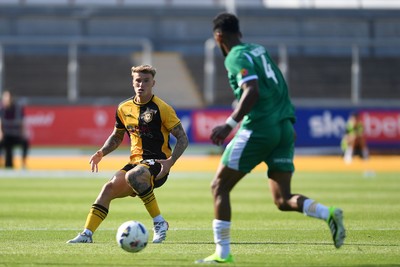 020825 - Newport County v Notts County - Sky Bet League 2 - Kai Whitmore of Newport County is challenged by Jacob Bedeau of Notts County