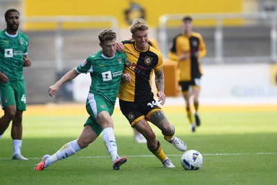 020825 - Newport County v Notts County - Sky Bet League 2 - Kai Whitmore of Newport County is challenged by Matt Palmer of Notts County