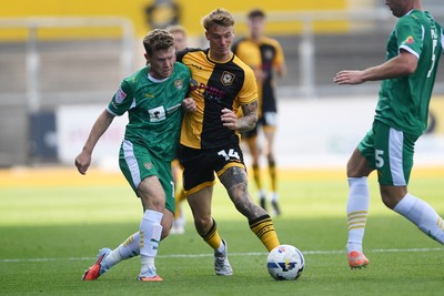 020825 - Newport County v Notts County - Sky Bet League 2 - Kai Whitmore of Newport County is challenged by Matt Palmer of Notts County
