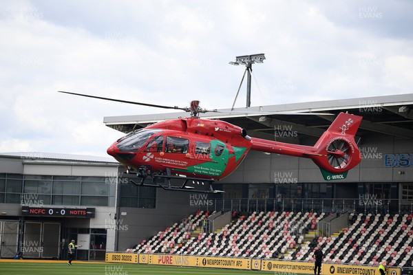 020825 - Newport County v Notts County - Sky Bet League 2 - An Emergency Helicopter lands on the pitch at Rodney Parade after a serious medical incident with a Notts County fan before the match, causing evacuation of the stadium