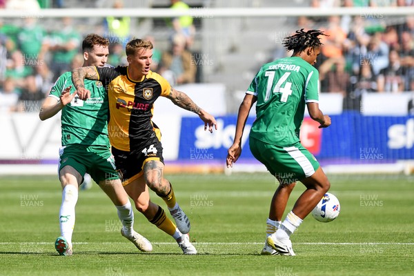 020825 - Newport County v Notts County - Sky Bet League 2 - Kai Whitmore of Newport County is challenged by Milai Perott of Notts County