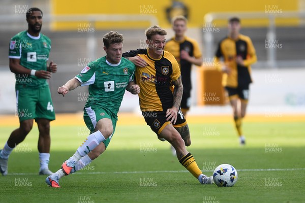 020825 - Newport County v Notts County - Sky Bet League 2 - Kai Whitmore of Newport County is challenged by Matt Palmer of Notts County