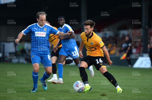 210818 - Newport County v Notts County - SkyBet League 2 - Josh Sheehan of Newport County looks for a way past David Vaughan of Notts County