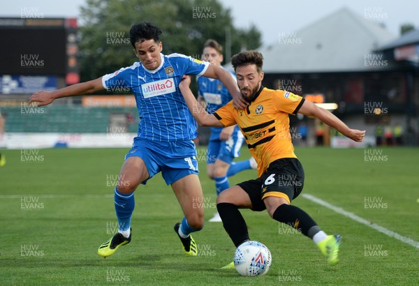 210818 - Newport County v Notts County - SkyBet League 2 - Josh Sheehan of Newport County is tackled by Noor Husin of Notts County