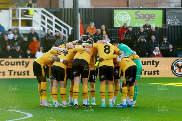 041123 - Newport County v Oldham Athletic - FA Cup First Round - Players of Newport County huddle before kick off