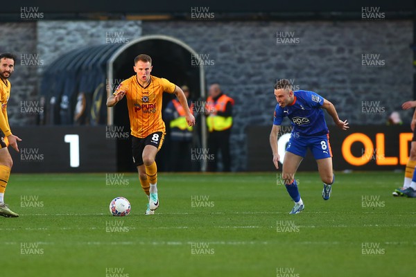 041123 - Newport County v Oldham Athletic - FA Cup First Round - Bryn Morris of Newport County races away from Josh Lundstrum of Oldham Athletic