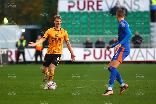 041123 - Newport County v Oldham Athletic - FA Cup First Round - Ryan Delaney of Newport County looks for options under pressure from Mark Kitching of Oldham Athletic