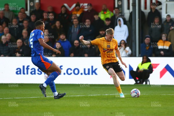 041123 - Newport County v Oldham Athletic - FA Cup First Round - Will Evans of Newport County whips in a cross
