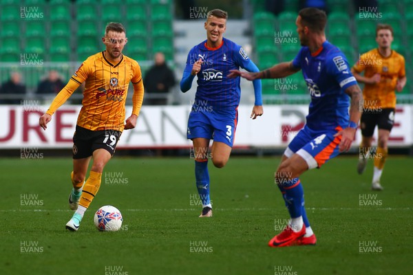 041123 - Newport County v Oldham Athletic - FA Cup First Round - Shane McLouoghlin of Newport County takes on Liam Hogan of Oldham Athletic