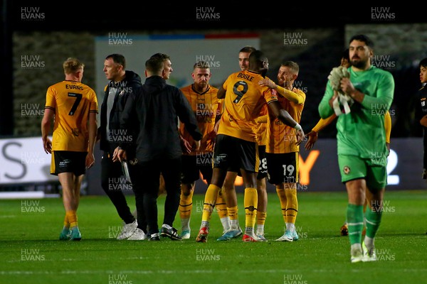041123 - Newport County v Oldham Athletic - FA Cup First Round - Players of Newport County celebrate at the end of the game