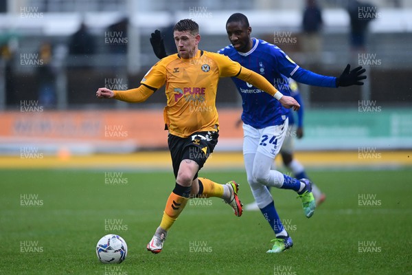 120222 - Newport County v Oldham Athletic - Sky Bet League 2 - Scot Bennett of Newport County under pressure from Dylan Bahamboula of Oldham Athletic 
