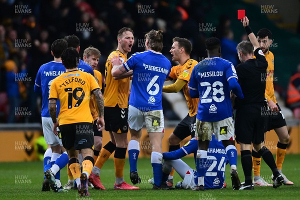 120222 - Newport County v Oldham Athletic - Sky Bet League 2 - Dylan Bahamboula of Oldham Athletic (24, on floor) is shown a red card 