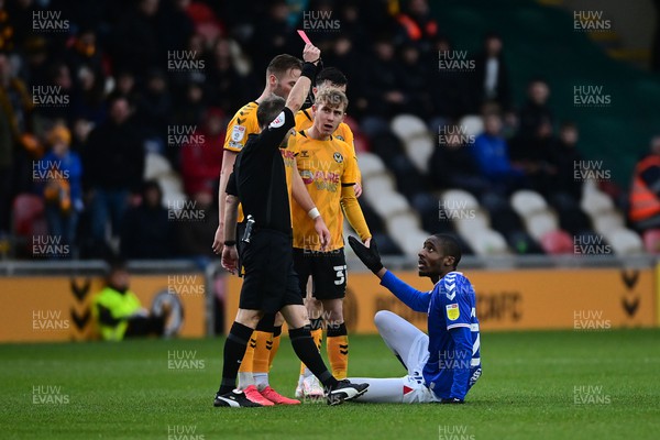 120222 - Newport County v Oldham Athletic - Sky Bet League 2 - Dylan Bahamboula of Oldham Athletic is shown a Red card