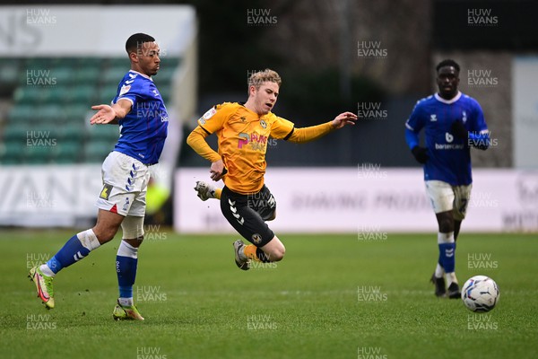 120222 - Newport County v Oldham Athletic - Sky Bet League 2 - Oli Cooper of Newport County under pressure from Jordan Clarke of Oldham Athletic 
